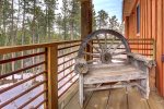 Foote Creek Lodge deck with antique chair. 